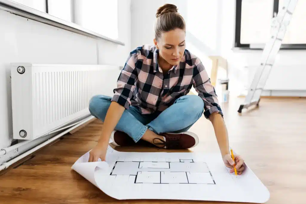 Person on floor with layout