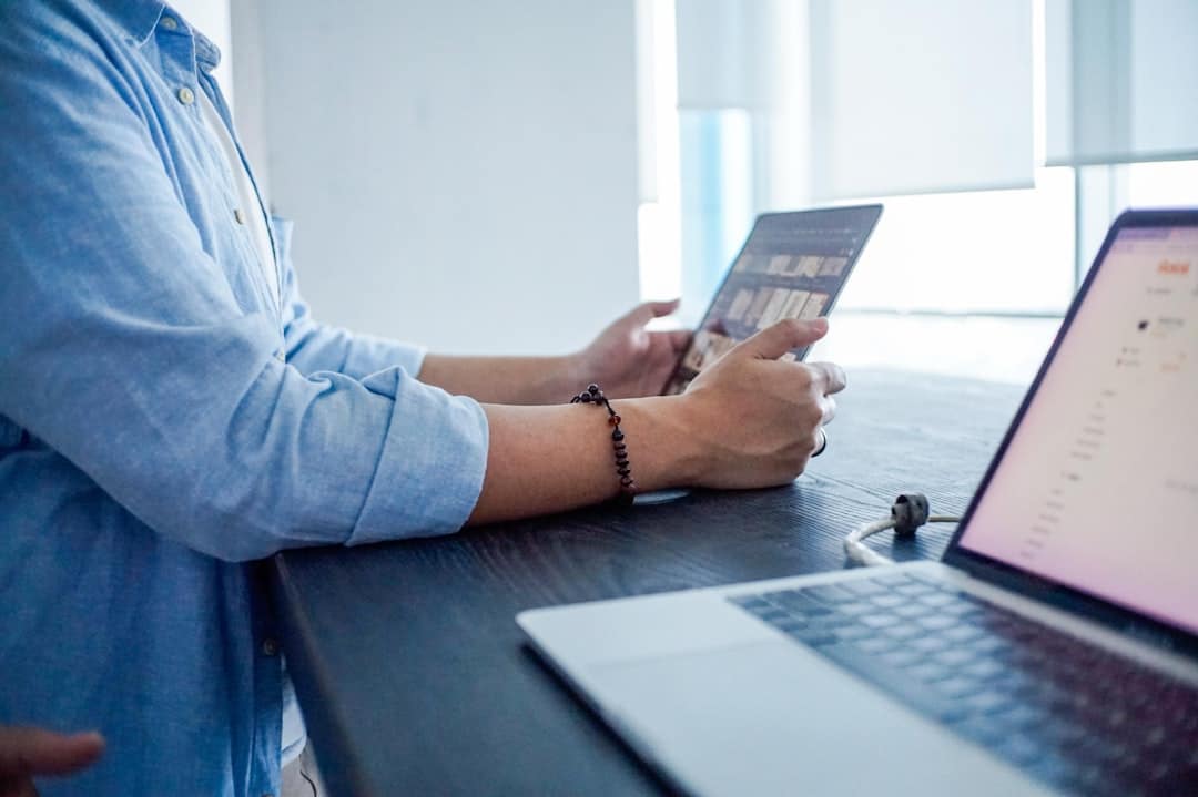 A person uses a stylus to sign a digital real estate contract on a tablet, representing the modern, efficient approach to selling a home.