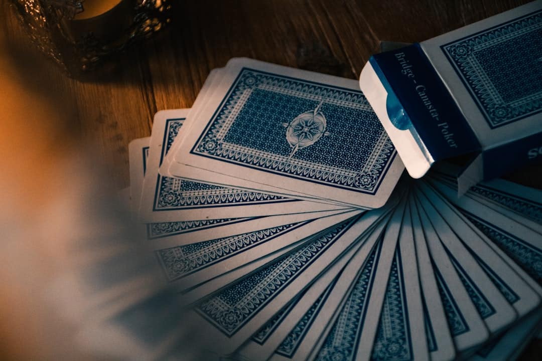 A house of cards built on a professional boardroom table, representing the fragile and risky nature of using a discount real estate service.