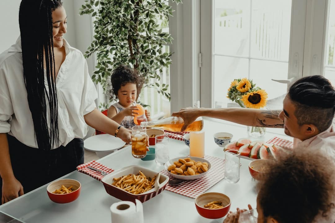 A joyful family celebrating in their modern, light-filled kitchen, representing the financial freedom gained from saving thousands on realtor commissions.