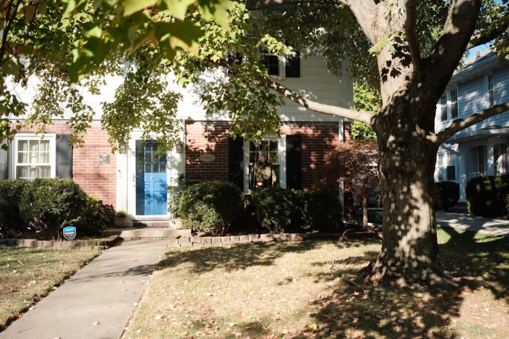 Welcoming and upscale suburban home with a large front porch, representing a valuable Northshore property and the equity a...