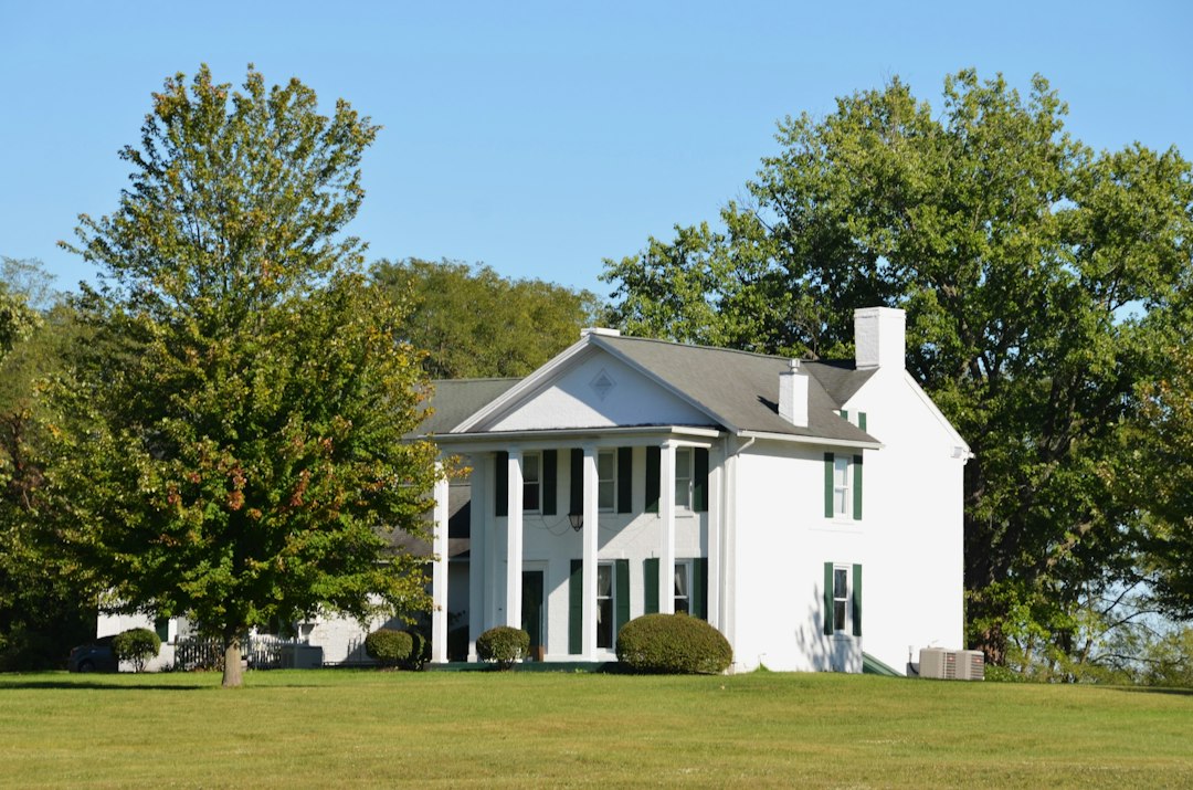 The bright, welcoming exterior of an upscale suburban home in a southern style, representing a desirable Northshore property for sale on a sunny day.
