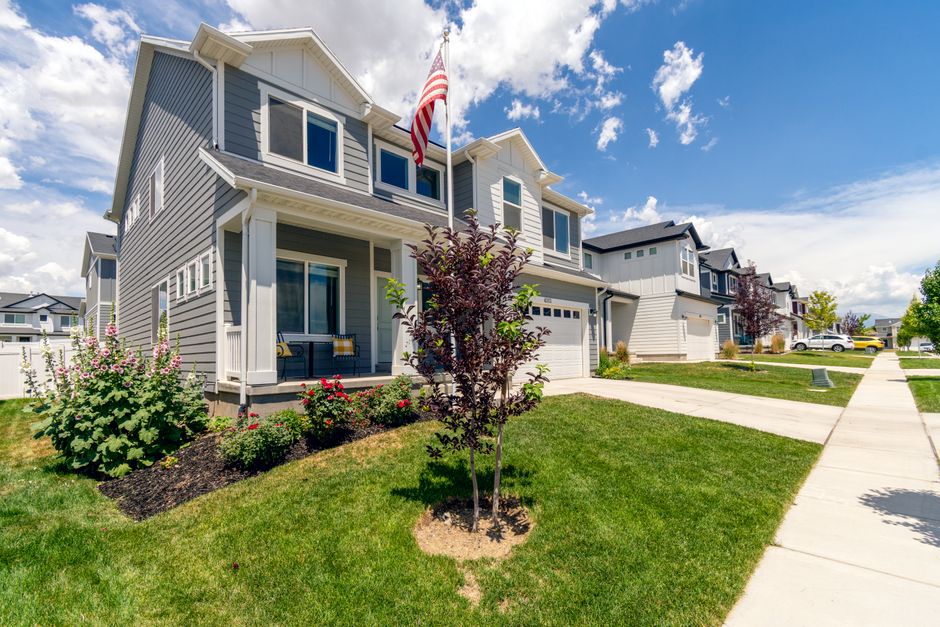 The exterior of a welcoming modern suburban home on a bright, sunny day, representing a high-value property on the Northshore.